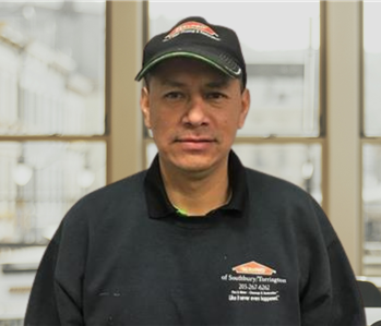 man with servpro hats and shirts