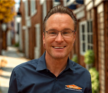 Man with brown hair smiling