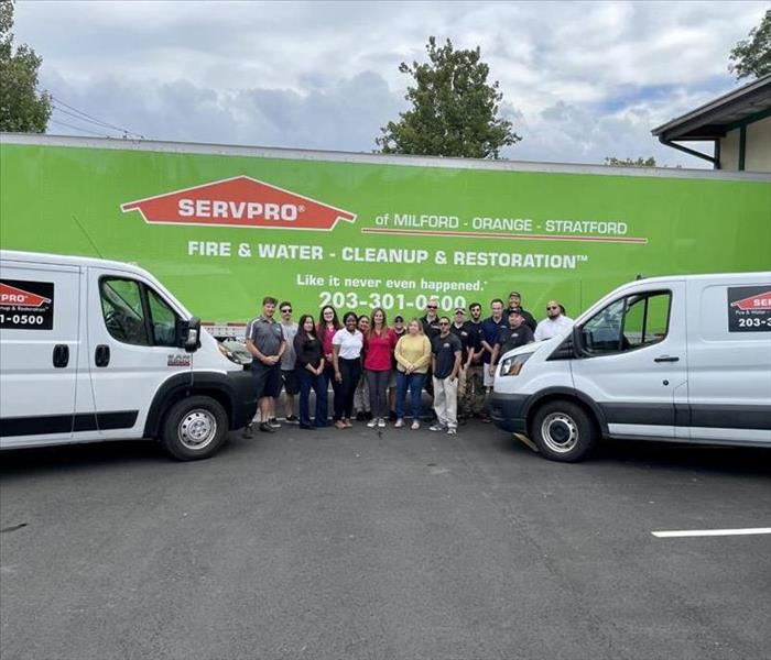 Servpro trailer and vans with crew in front of it