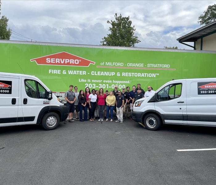Servpro of Milford Orange Stratford team in front of a truck
